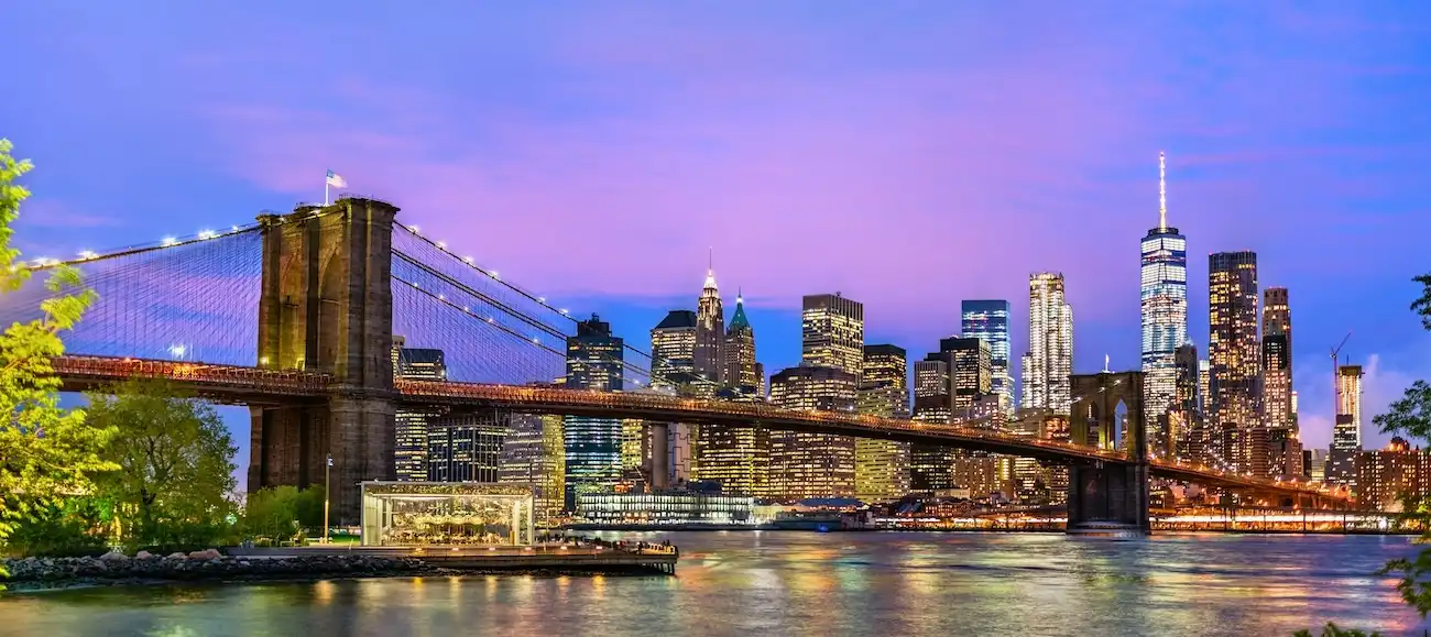 Iconic view of the Brooklyn Bridge spanning across the East River in New York City.