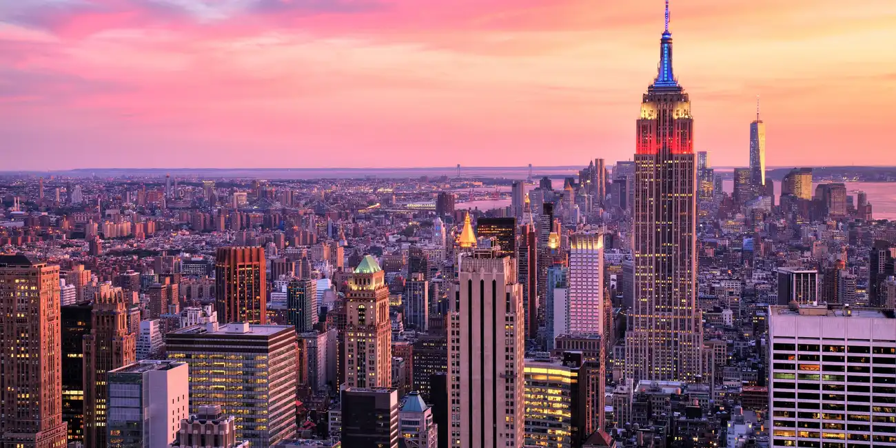 View of the Empire State Building towering over the New York City skyline - Best Things to Do in New York City with NYC Pass.